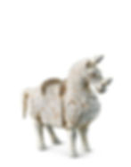 Ancient clay horse figurine with a textured, worn surface in light beige and brown. It's standing against a plain white background.