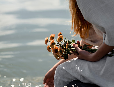 side-view-woman-holding-flowers.jpg