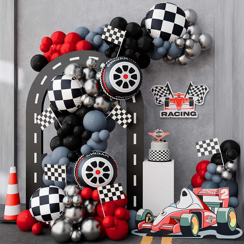 Race-themed decor with red, black, and silver balloons, checkered flags, racing car cutout, and road pattern. Sign reads "Racing."