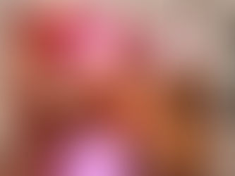 Iced coffee cup with black straw on table, text reads "you are so loved," colorful blurred background, warm and inviting mood.