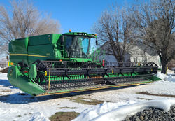 Combine Harvester on Field