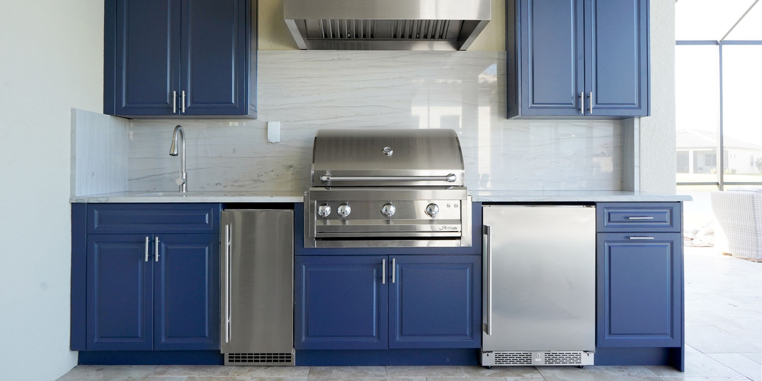 custom outdoor kitchen in naples fliorida with blue cabinets