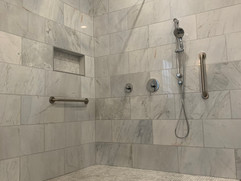 bathroom renovation with grey tiled shower