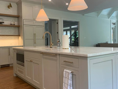 kitchen remodel with kitchen sink inside of custom island