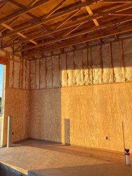 commercial electrician in Athens GA installing wire in ceiling and walls