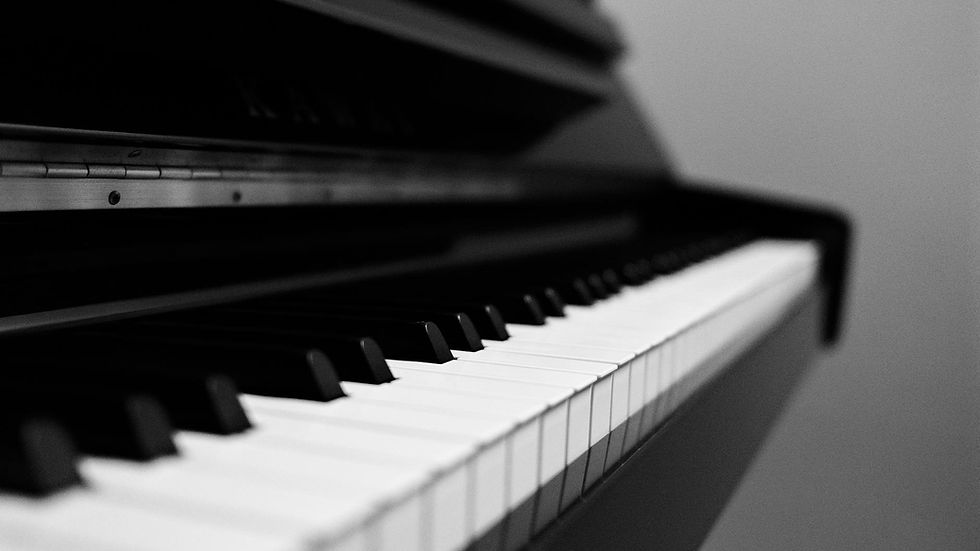 Elegant black and white photo capturing the timeless beauty of piano keys. Ideal for music lovers.