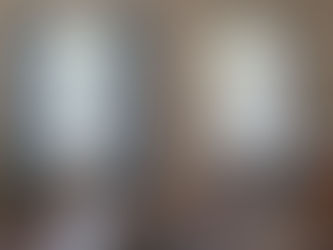 Paired curtains beside a single curtain panel