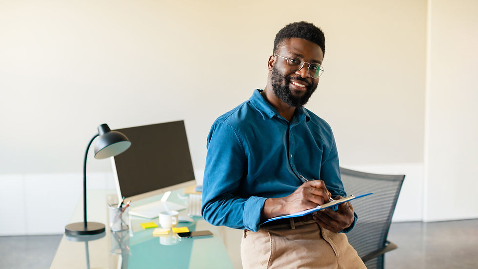 portrait-happy-black-businessman-standing-office-posing-looking-camera-holding-clipboard-p