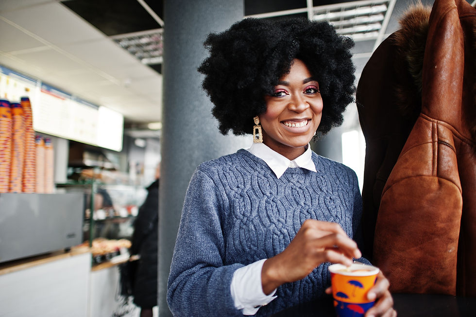 curly-hair-african-american-woman-wear-sweater-posed-cafe-indoor-with-cup-tea-coffee.jpg