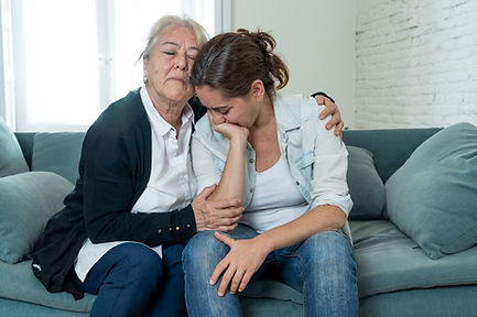 Two female family members sitting on couch