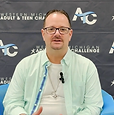 Man sitting in a blue chair