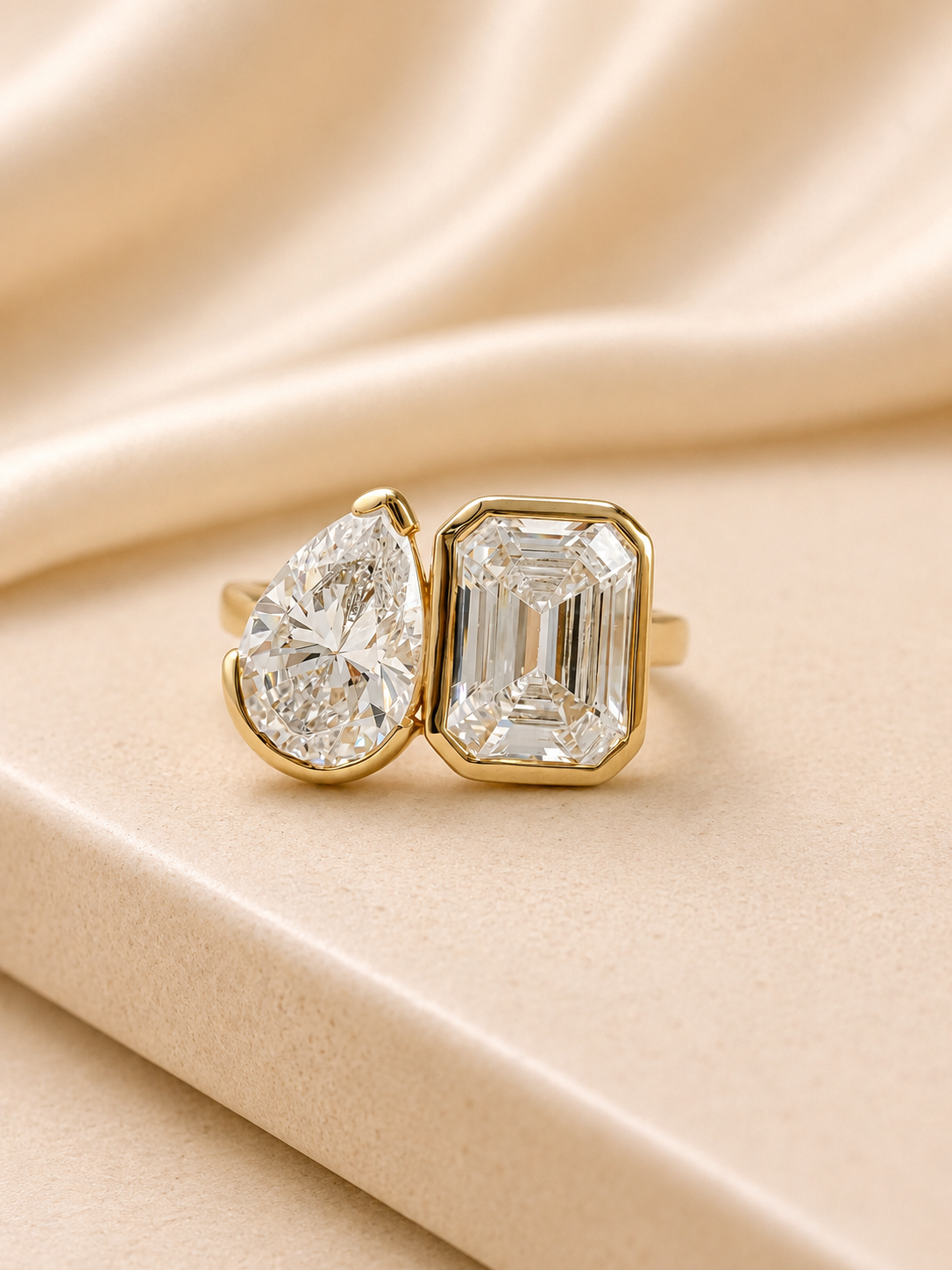 Tate two stone engagement ring with a pear cut and an emerald cut lab grown diamond