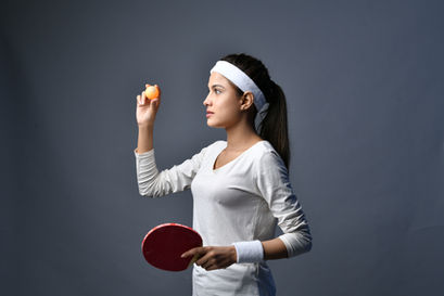 sports-women-holding-table-tennis-ball-indian-pakistani-model.jpg
