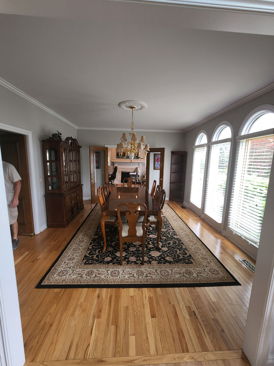 Dining room with large windows and hanging lights