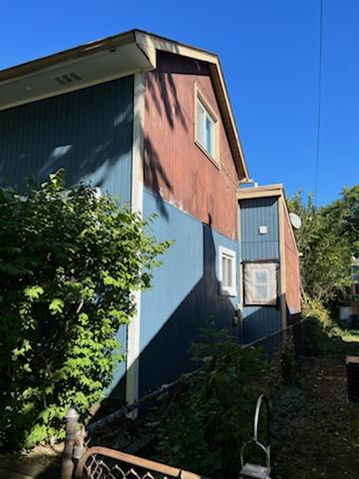 partially exterior painted blue house