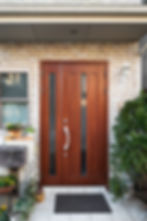 Brown finished front door with fancy handle