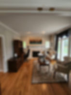 Home office with crown molding and large windows