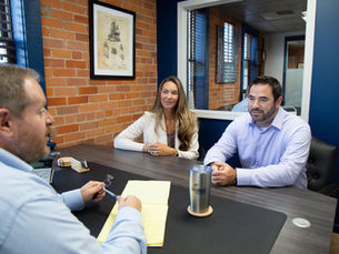 a lawyer meeting with two clients