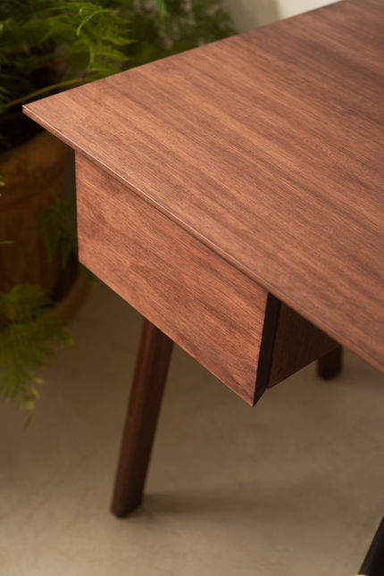 Detail of the corner of the Nonno Desk where the top, drawer box and leg meet