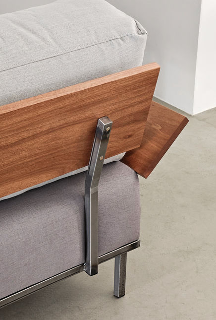 Close-up of the Indy Sofa solid wood back panel and the steel upright that fixes it to the structure