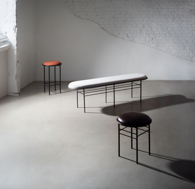 Bela Small stool in dark leather in the foreground, with a bar stool and a bench from the same collection behind