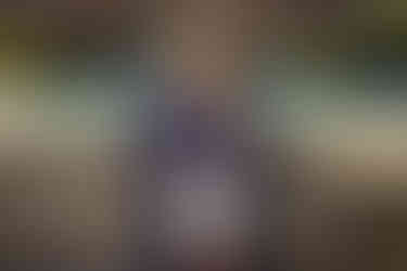 Old Main Fountain portrait of a girl holding her cap and gown