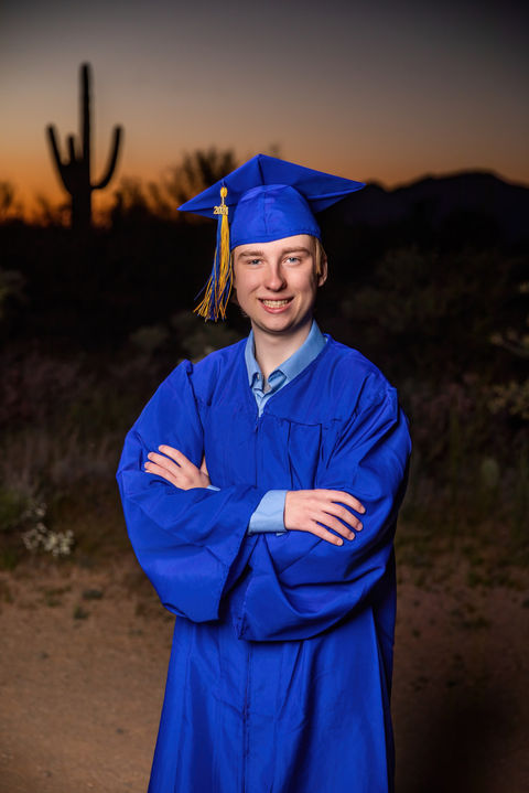 Senior portrait at Broadway Trail Head in Tucson AZ with his cap & gown. Senior portrait at Broadway Trail Head in Tucson AZ, Tucson Senior photos, Senior pics Tucson. Photo by Desert Owl Photography 