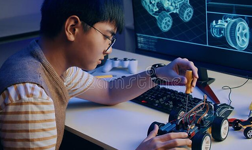 asian-teenager-doing-arduino-robot-homework-project-house-asian-teenager-doing-arduino-rob