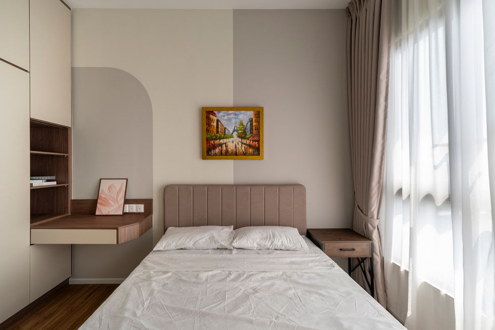 Bedroom with a bed, painting, and window curtains.