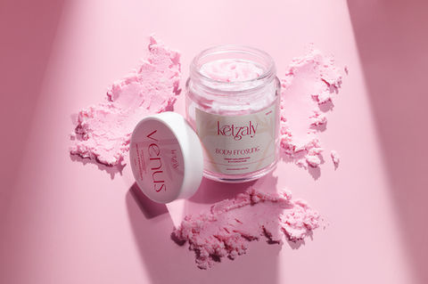 Skincare jas with smudged textures on pink background, product photography by Karolina Ferbei Photography