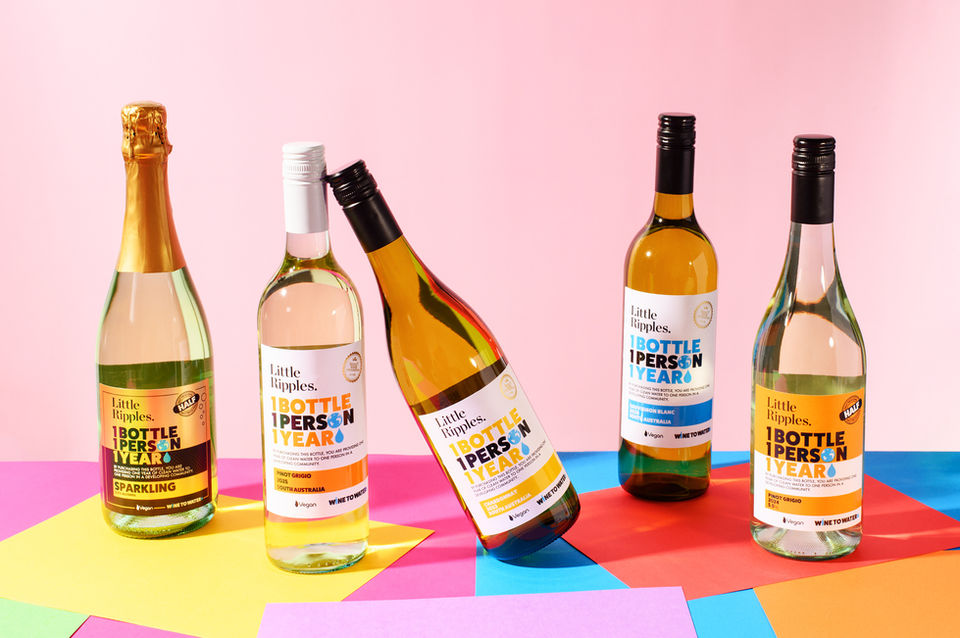 Bottles of wine on colorful background. product photography by Karolina Ferbei Photography