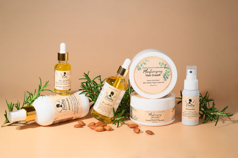Various skincare products with scattered almonds and herbs. product photography by Karolina Ferbei Photography