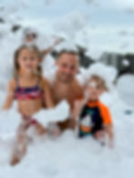 dad and kids in foam