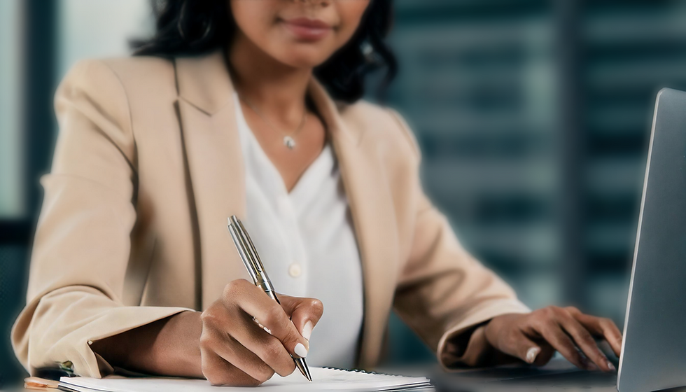 Close-up of a professional woman writing on a notepad.