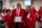 Brother Steve Johnson, Immediate Past Polemarch, stands with Silhouettes as he receives a certificate of appreciation during the Denton-Lewisville Alumni Chapter’s officer installation ceremony.
