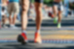 Runners crossing the finish line at New Haven Road Race.