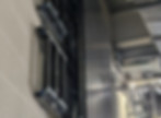 Audio visual engineers repairing and reinstalling video wall displays in Kia Oval concourse
