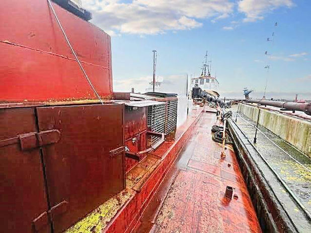 A red metal structure on a boat