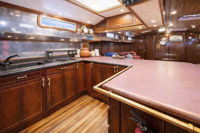 Trent 18 yacht galley with wooden cabinets