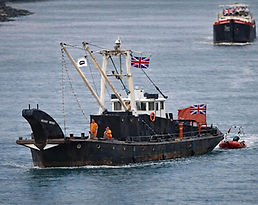 Medway Rhino working boat navigates the river alongside another boat.  