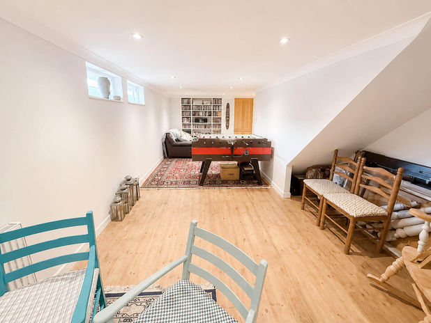 Recreation room with football table, blue chairs