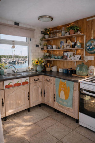 Kitchen with wood cabinets, open shelves, and marina view