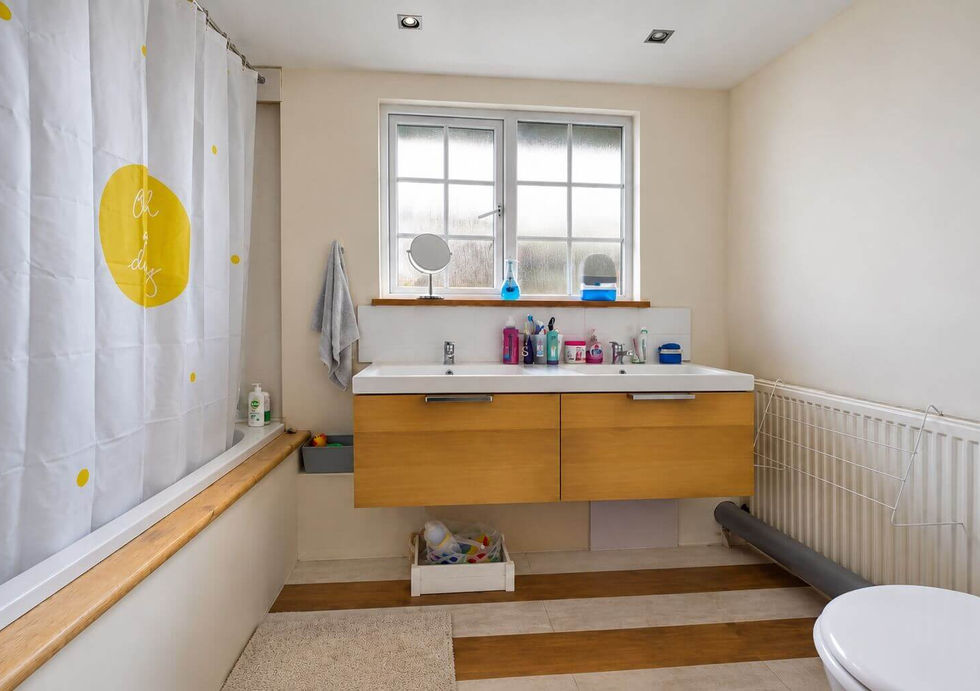 Family bathroom aboard Perch houseboat with double vanity and bath.