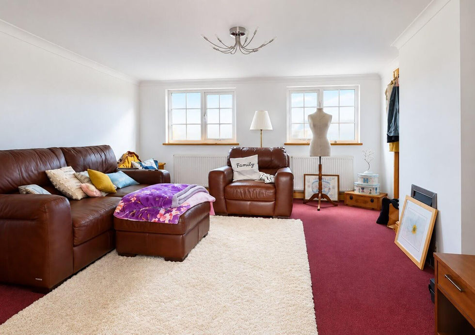 Spacious lounge aboard Perch houseboat with leather seating and large windows.