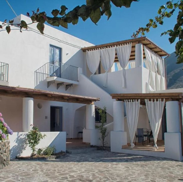 White Mediterranean villa style accommodations with balconies.