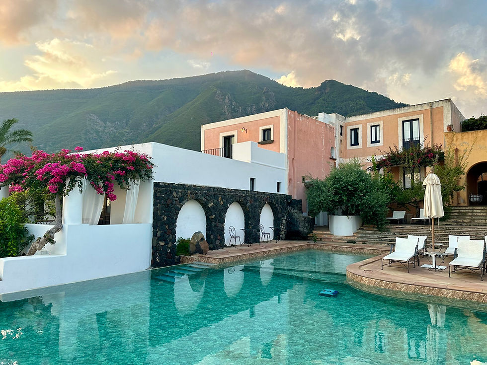 Resort pool with mountain views and Mediterranean villas