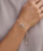 evil eye bracelet diamonds and sapphire yellow gold