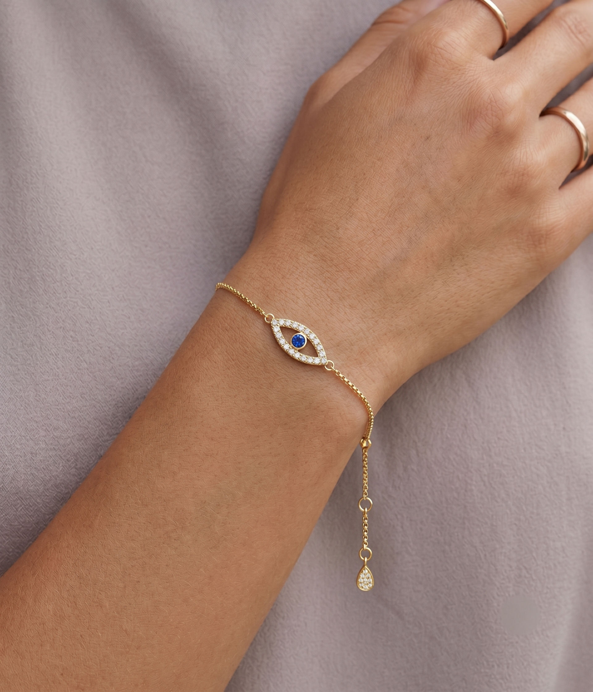 evil eye bracelet diamonds and sapphire yellow gold
