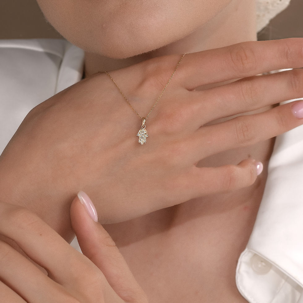 hamsa pendant and a gold chain