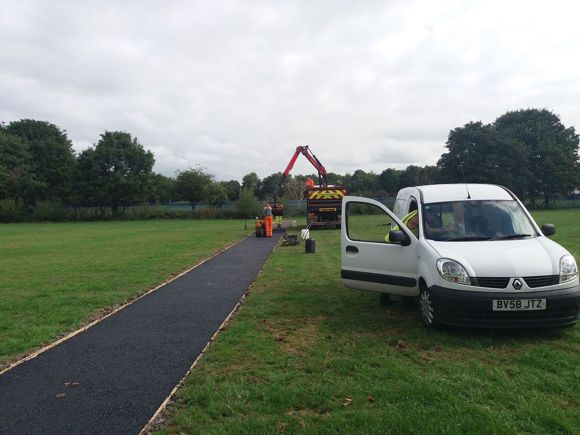 Hilton Main Construction's grab wagon and paver paving new running track at West Midlands school